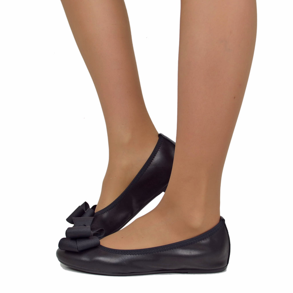 Black women's ballet flats with elasticated bow and internal wedge